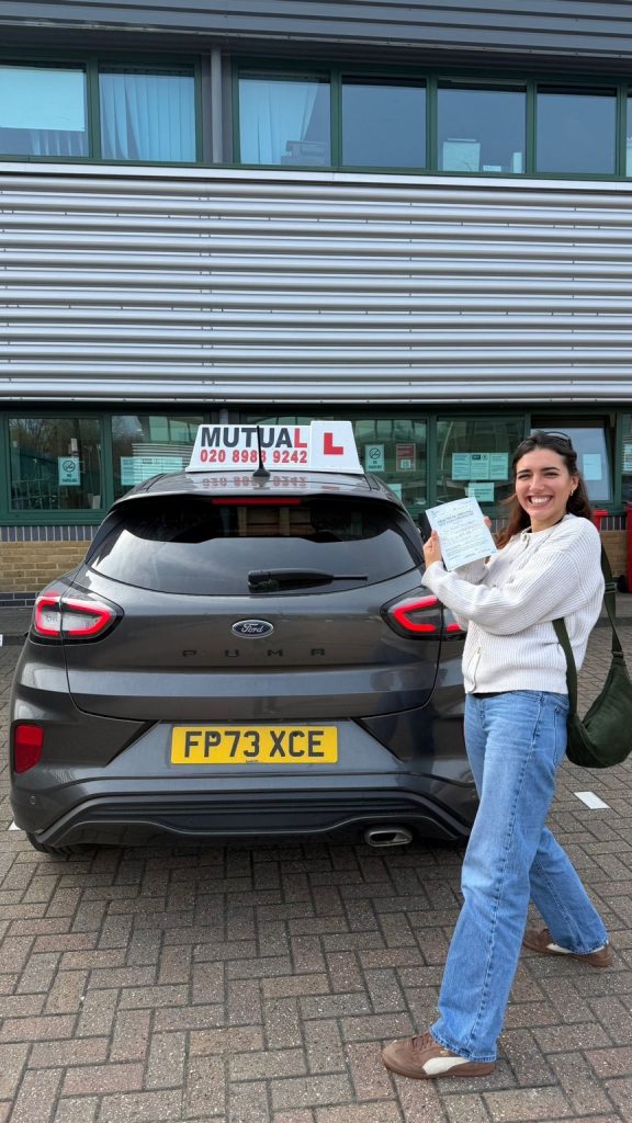 Mutual Driving School pupil celebrating a driving test pass