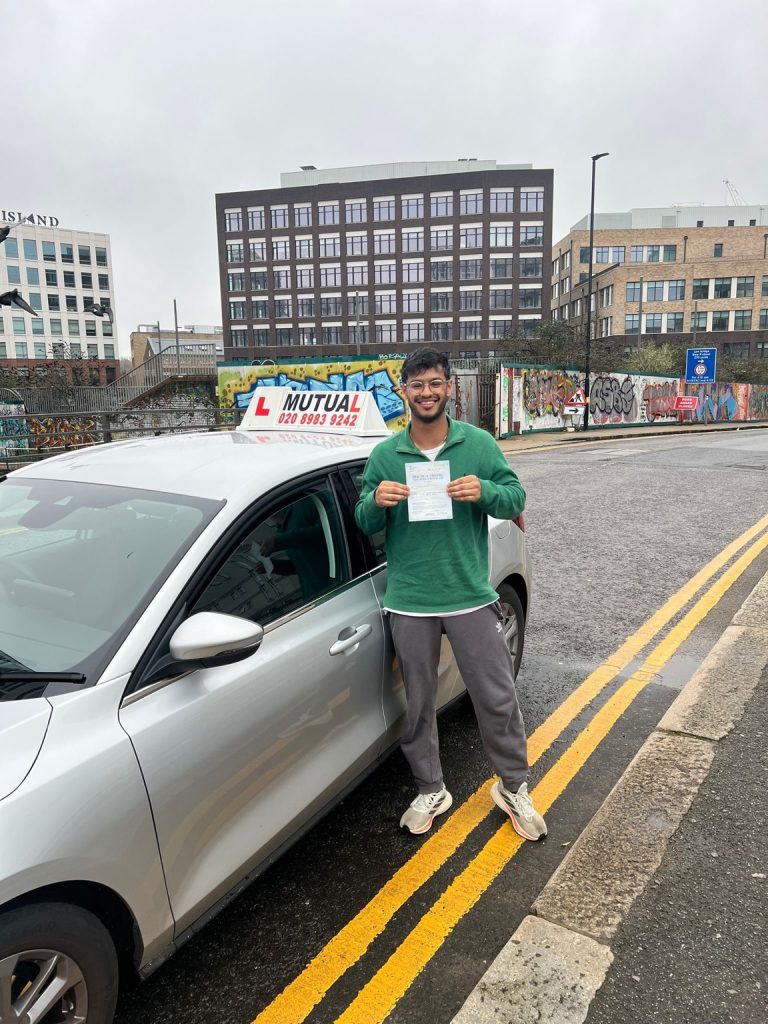 Mutual Driving School pupil celebrating a driving test pass