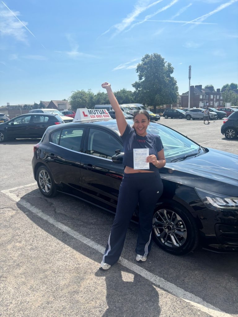 Mutual Driving School pupil celebrating a driving test pass